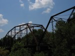 Old truss bridge over a small river in Texas.
